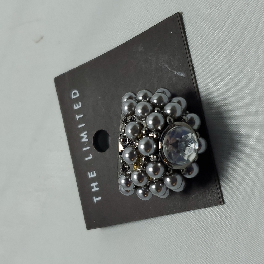 The limited black pearl with clear stone ring